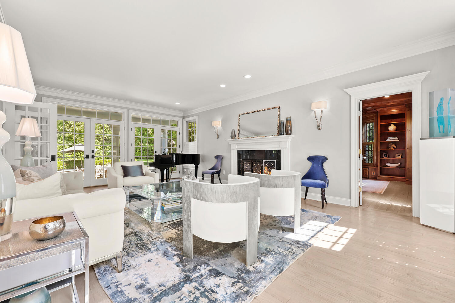 35 Logan Road New Canaan, CT 06840 - Photo 3 of 73 a living room with furniture a fireplace and a table