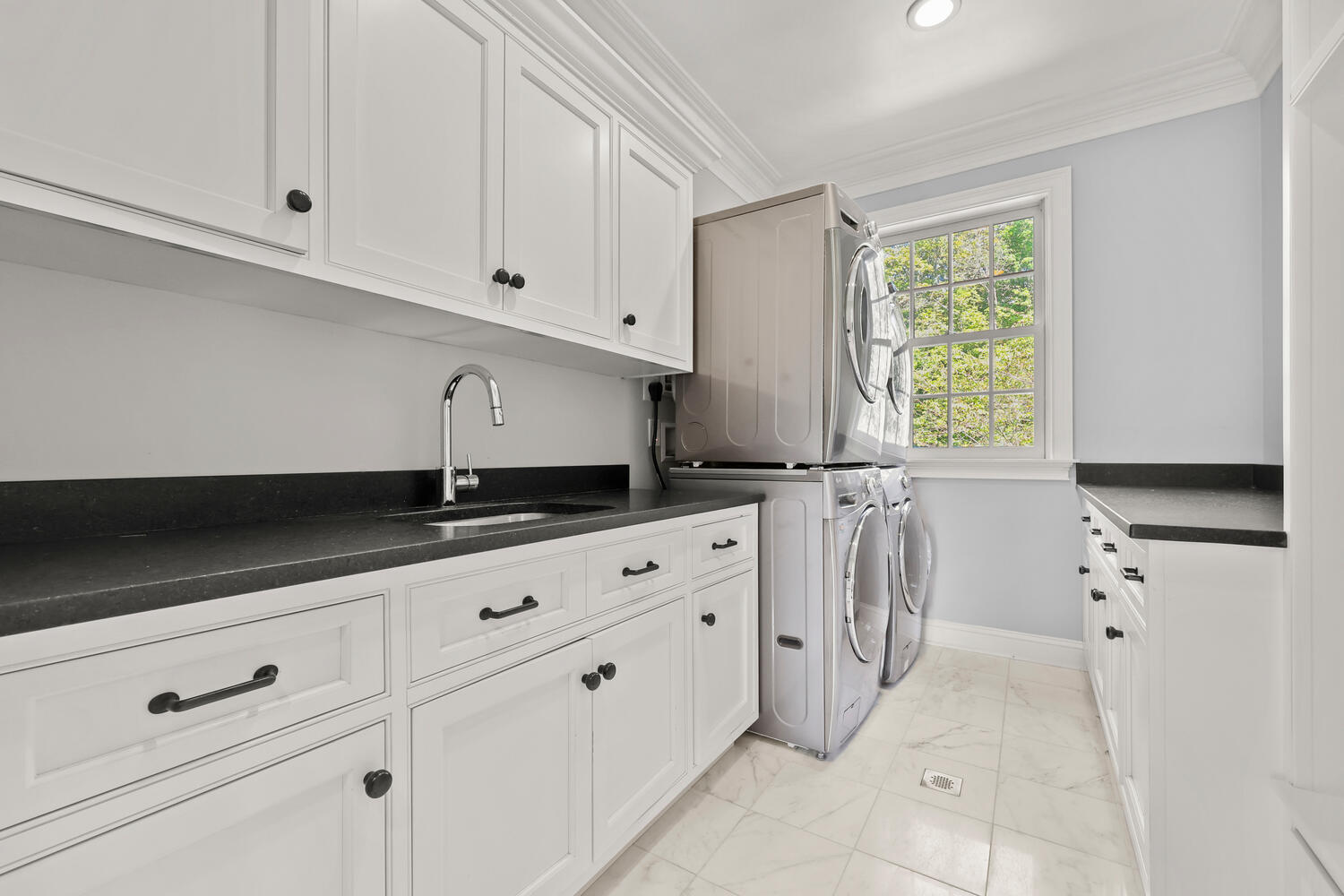 35 Logan Road New Canaan, CT 06840 - Photo 31 of 73 a kitchen with granite countertop white cabinets and white appliances