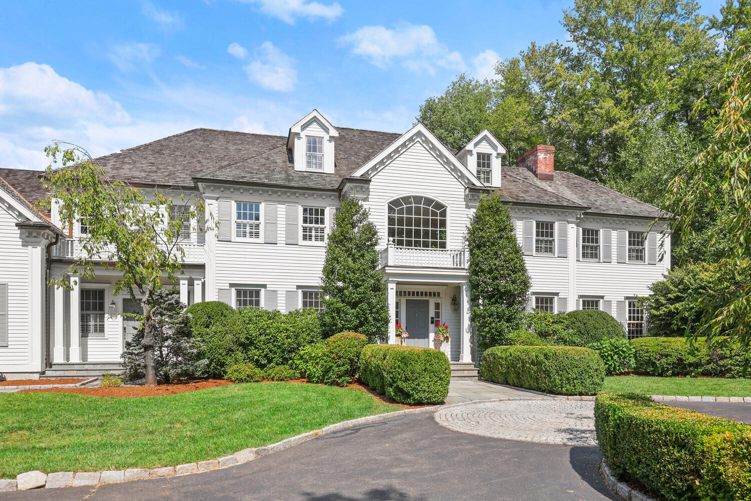35 Logan Road New Canaan, CT 06840 - Photo 39 of 73 a front view of a house with a yard
