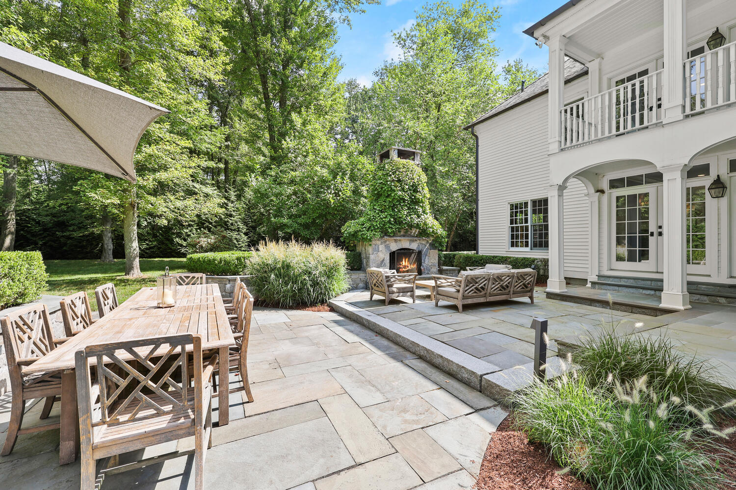35 Logan Road New Canaan, CT 06840 - Photo 46 of 73 a view of a patio with table and chairs and potted plants