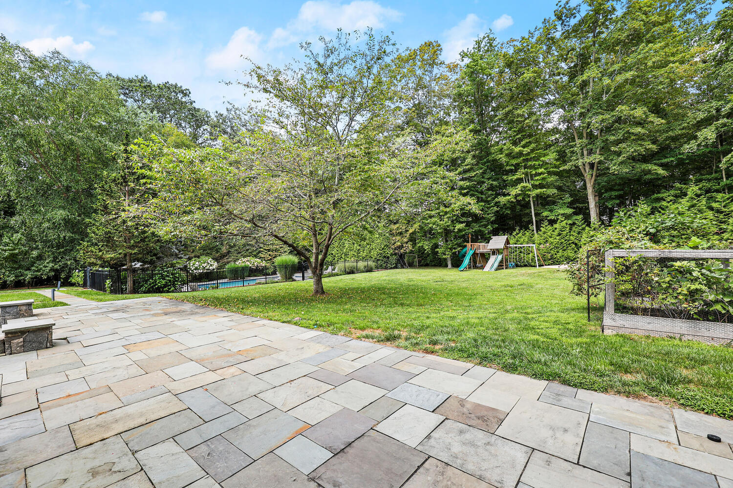 35 Logan Road New Canaan, CT 06840 - Photo 50 of 73 a view of a park with large trees