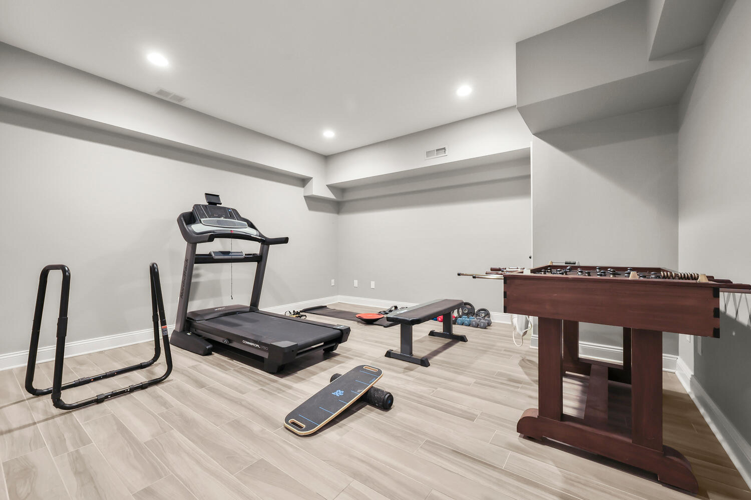 35 Logan Road New Canaan, CT 06840 - Photo 56 of 73 a living room with furniture a table and wooden floor