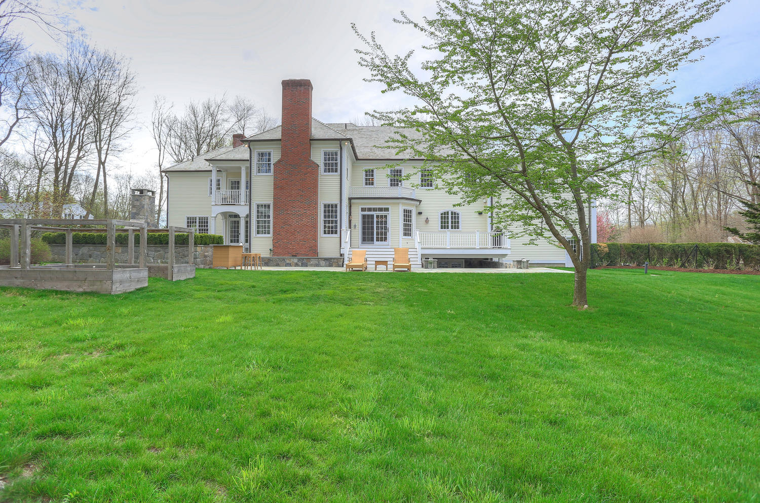 35 Logan Road New Canaan, CT 06840 - Photo 69 of 73 a front view of house with yard and green space