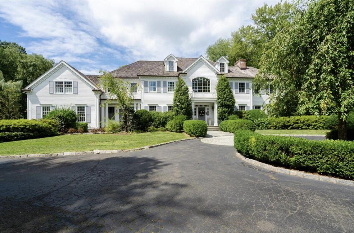 35 Logan Road New Canaan, CT 06840 - Photo 72 of 73 a view of a white house with a yard and plants