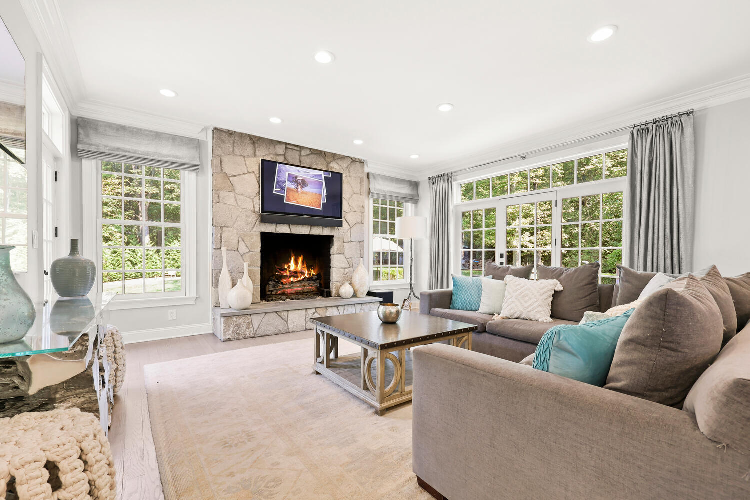 35 Logan Road New Canaan, CT 06840 - Photo 8 of 73 a living room with furniture large window and a fireplace