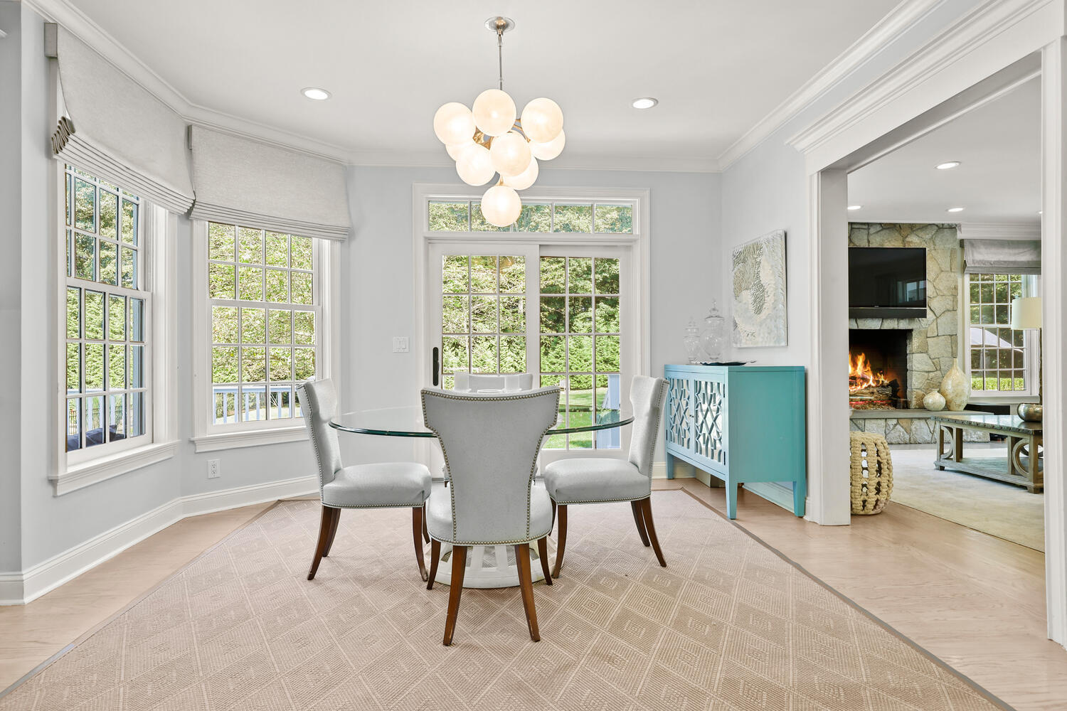 35 Logan Road New Canaan, CT 06840 - Photo 9 of 73 a dining room filled chandelier and wooden floor