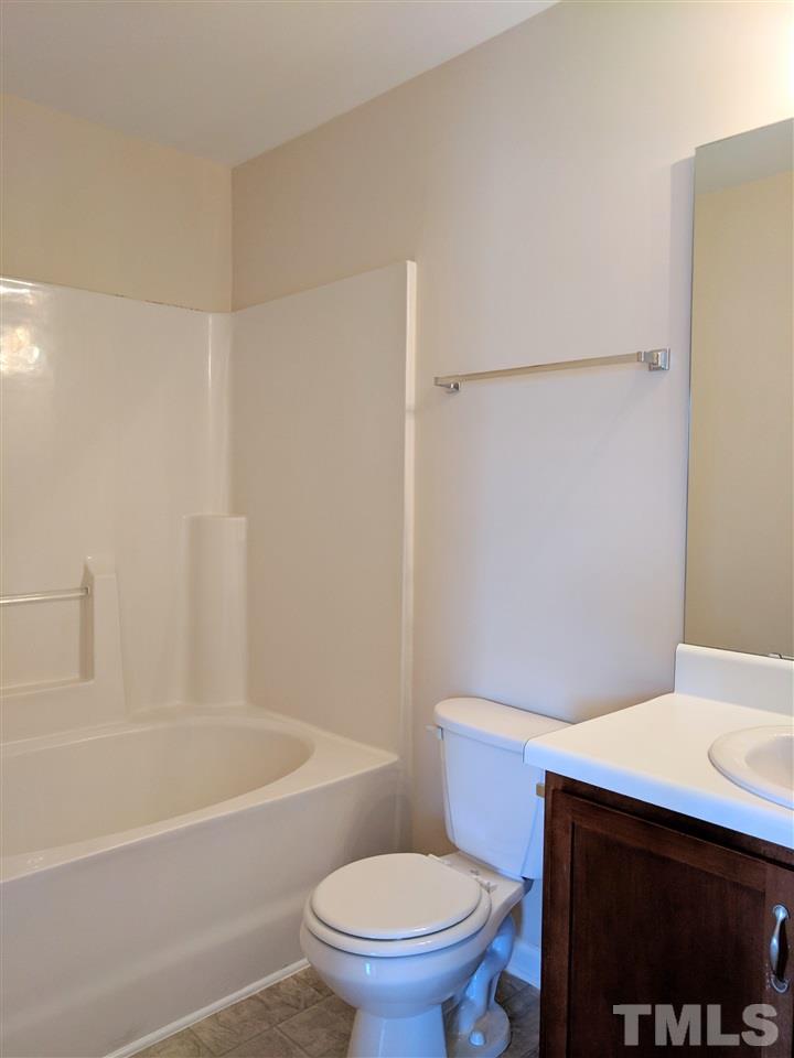 3124 Binghampton Lane Raleigh, NC 27604 - Photo 12 of 19 a bathroom with a sink a toilet and shower