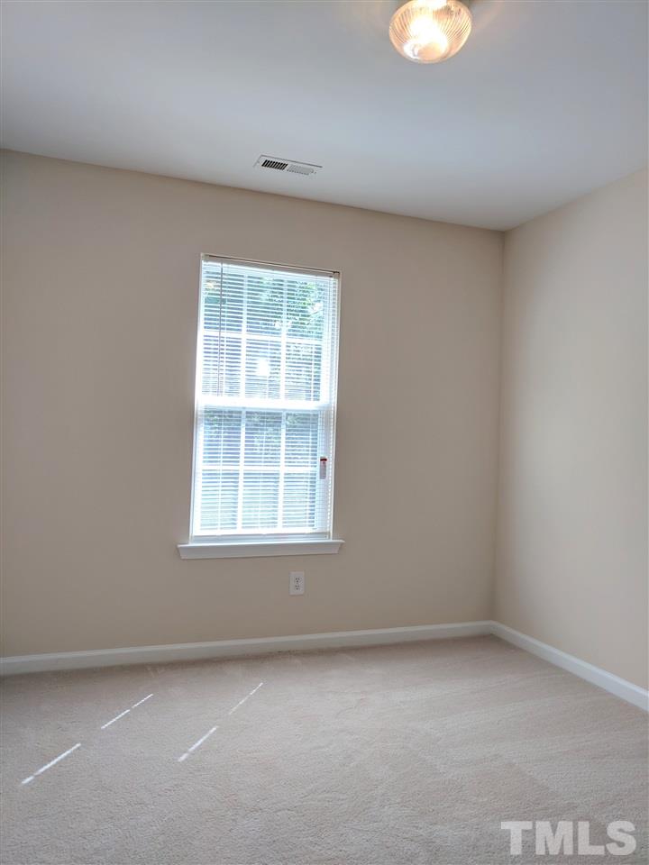 3124 Binghampton Lane Raleigh, NC 27604 - Photo 14 of 19 an empty room with a window