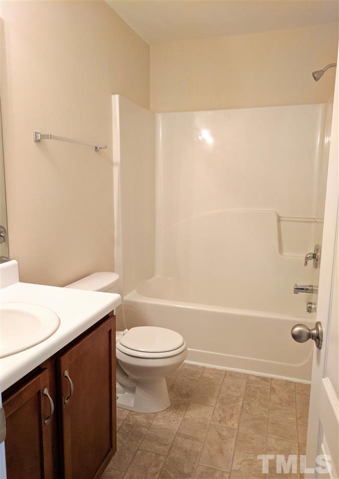 3124 Binghampton Lane Raleigh, NC 27604 - Photo 15 of 19 a bathroom with a granite countertop sink toilet and shower