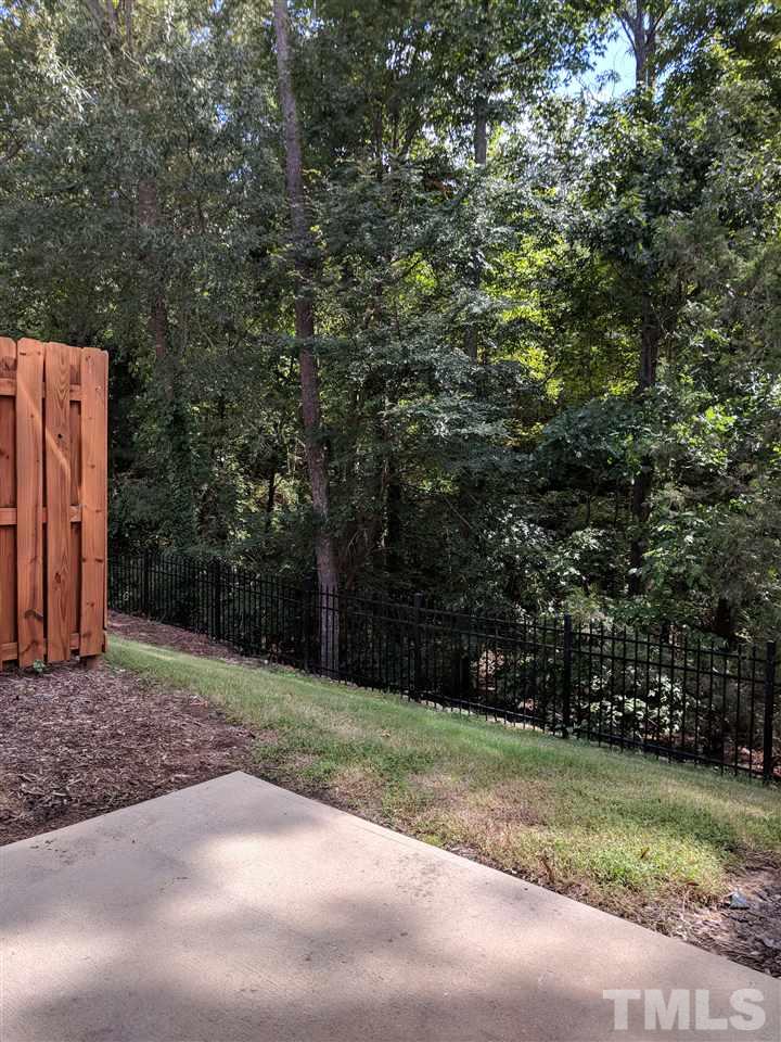 3124 Binghampton Lane Raleigh, NC 27604 - Photo 18 of 19 a backyard of a house with lots of green space