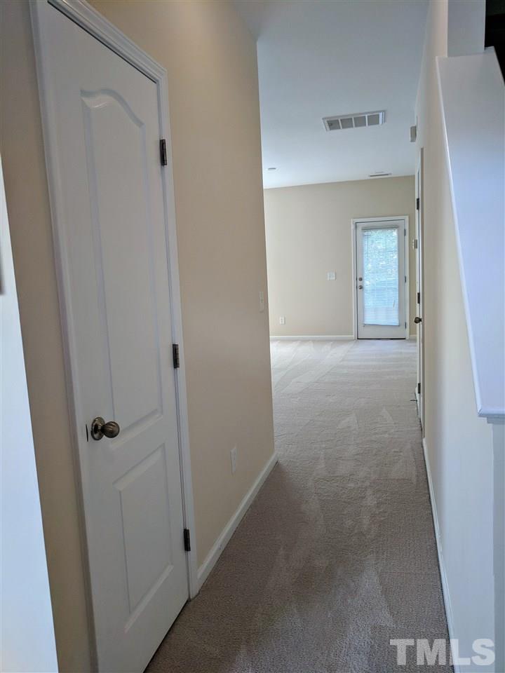 3124 Binghampton Lane Raleigh, NC 27604 - Photo 6 of 19 a view of a hallway to rooms