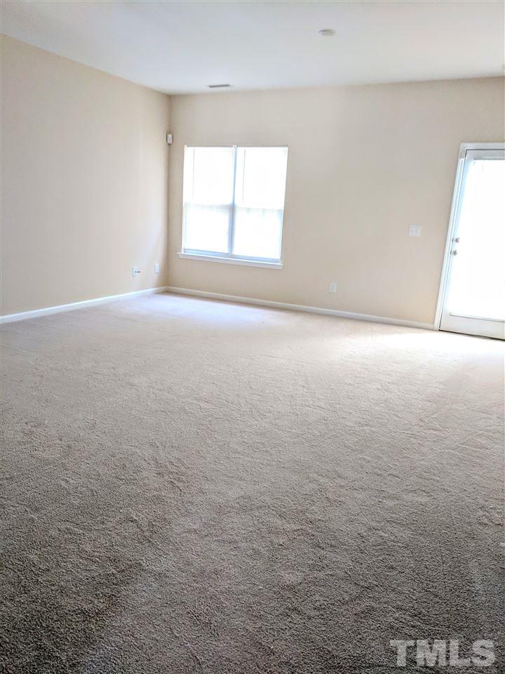 3124 Binghampton Lane Raleigh, NC 27604 - Photo 10 of 19 an empty room with a window
