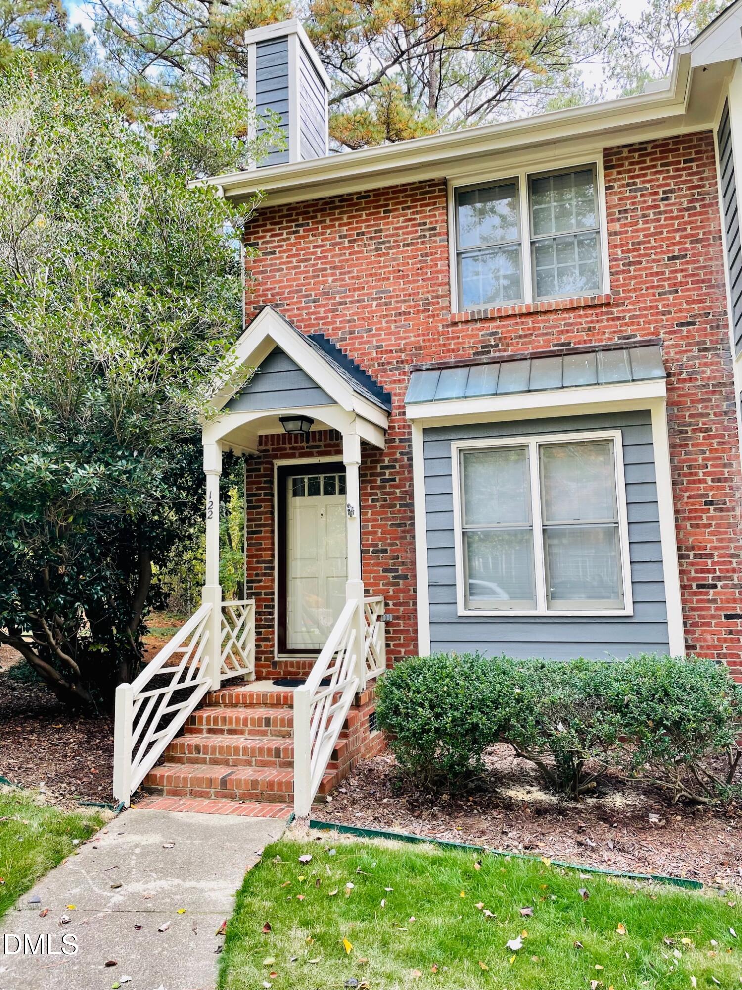 122 Winners Circle Cary, NC 27511 - Photo 1 of 14 a front view of a house with a yard