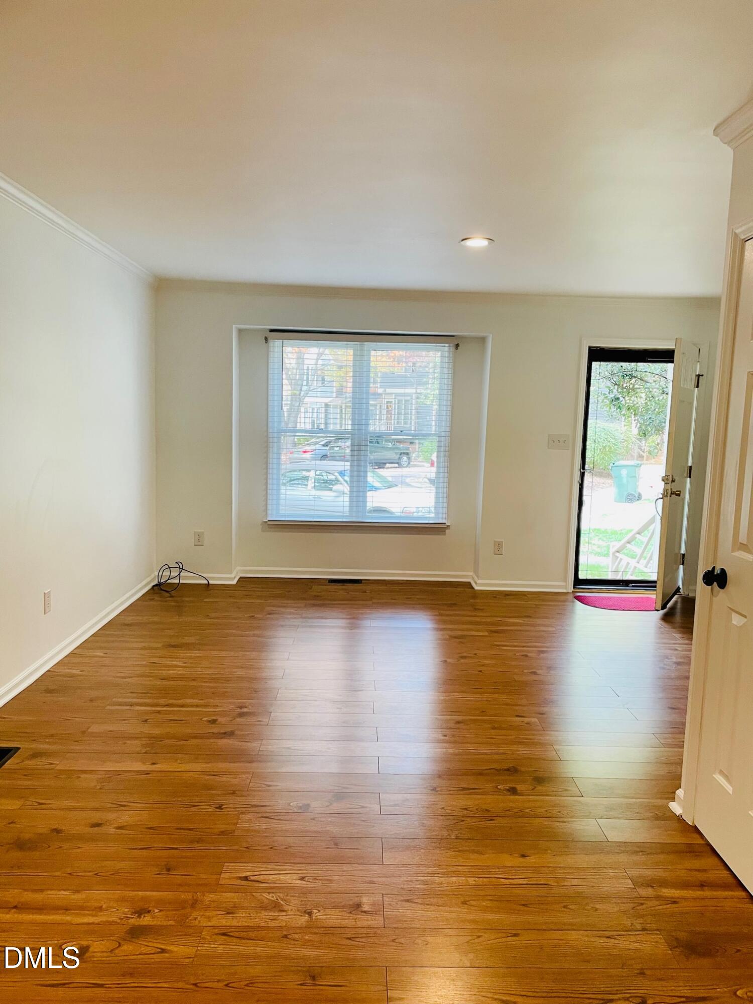 122 Winners Circle Cary, NC 27511 - Photo 12 of 14 a view of empty room with wooden floor and fan