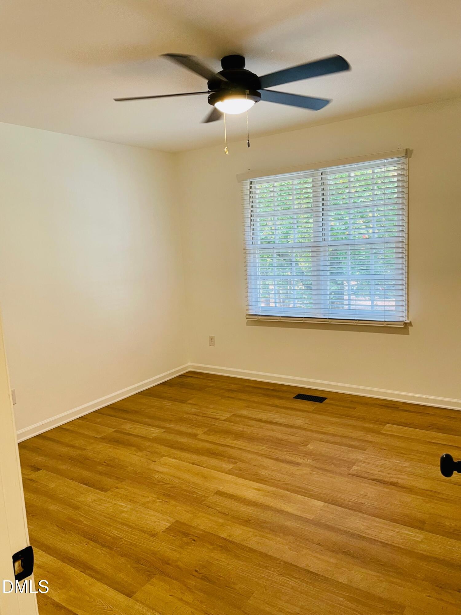 122 Winners Circle Cary, NC 27511 - Photo 8 of 14 a view of an empty room with a window