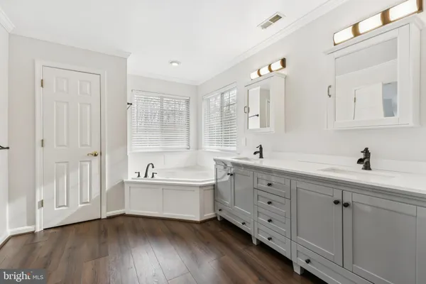a bathroom with a shower and a sink