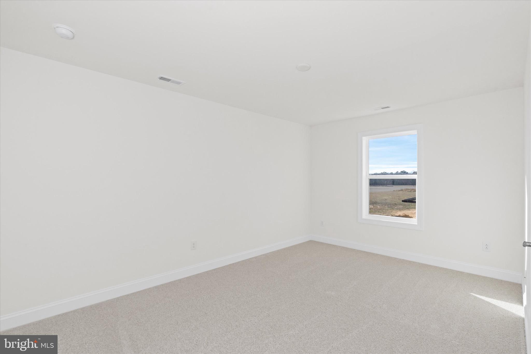 22484 Hummingbird Road, Unit 13 Ellendale, DE 19941 - Photo 15 of 34 an empty room with a window