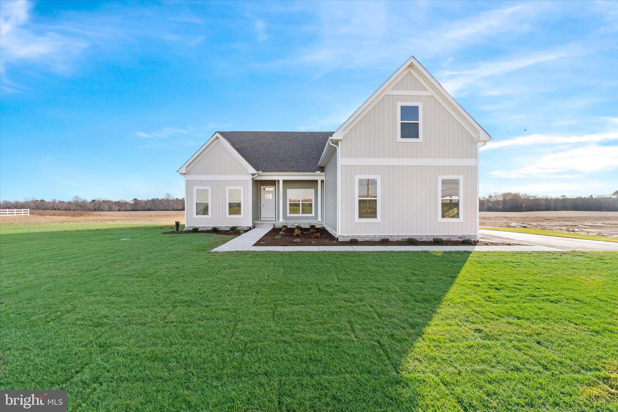 22484 Hummingbird Road, Unit 13 Ellendale, DE 19941 - Photo 2 of 34 a view of a house with a yard and front view of a house