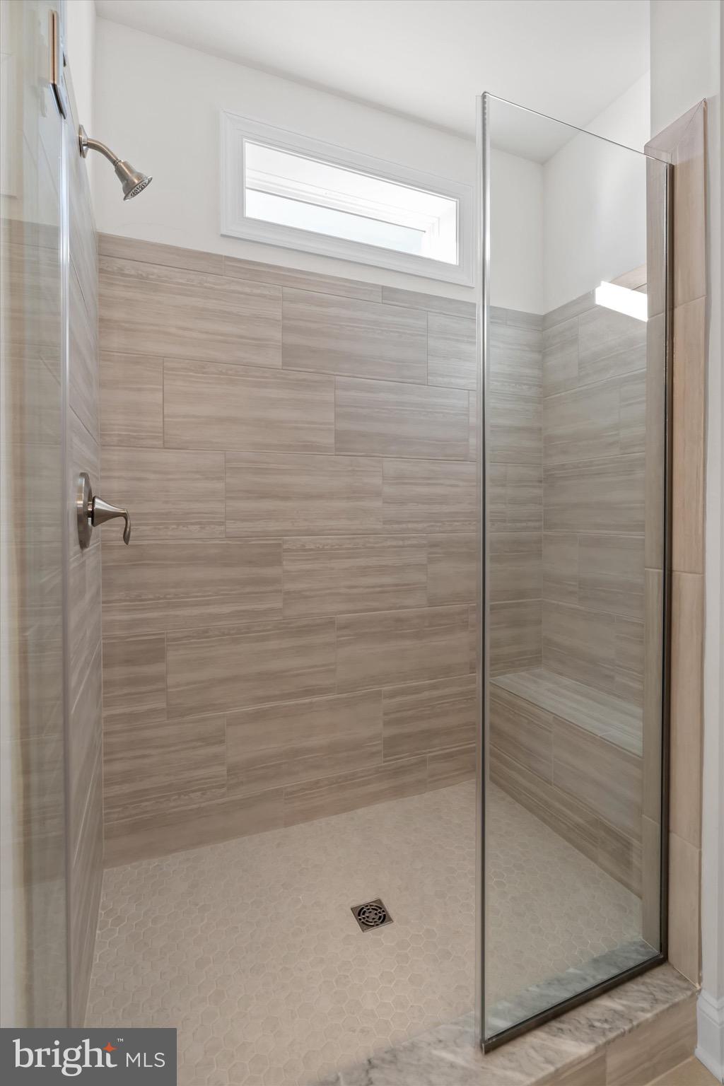 22484 Hummingbird Road, Unit 13 Ellendale, DE 19941 - Photo 26 of 34 a bathroom with a shower