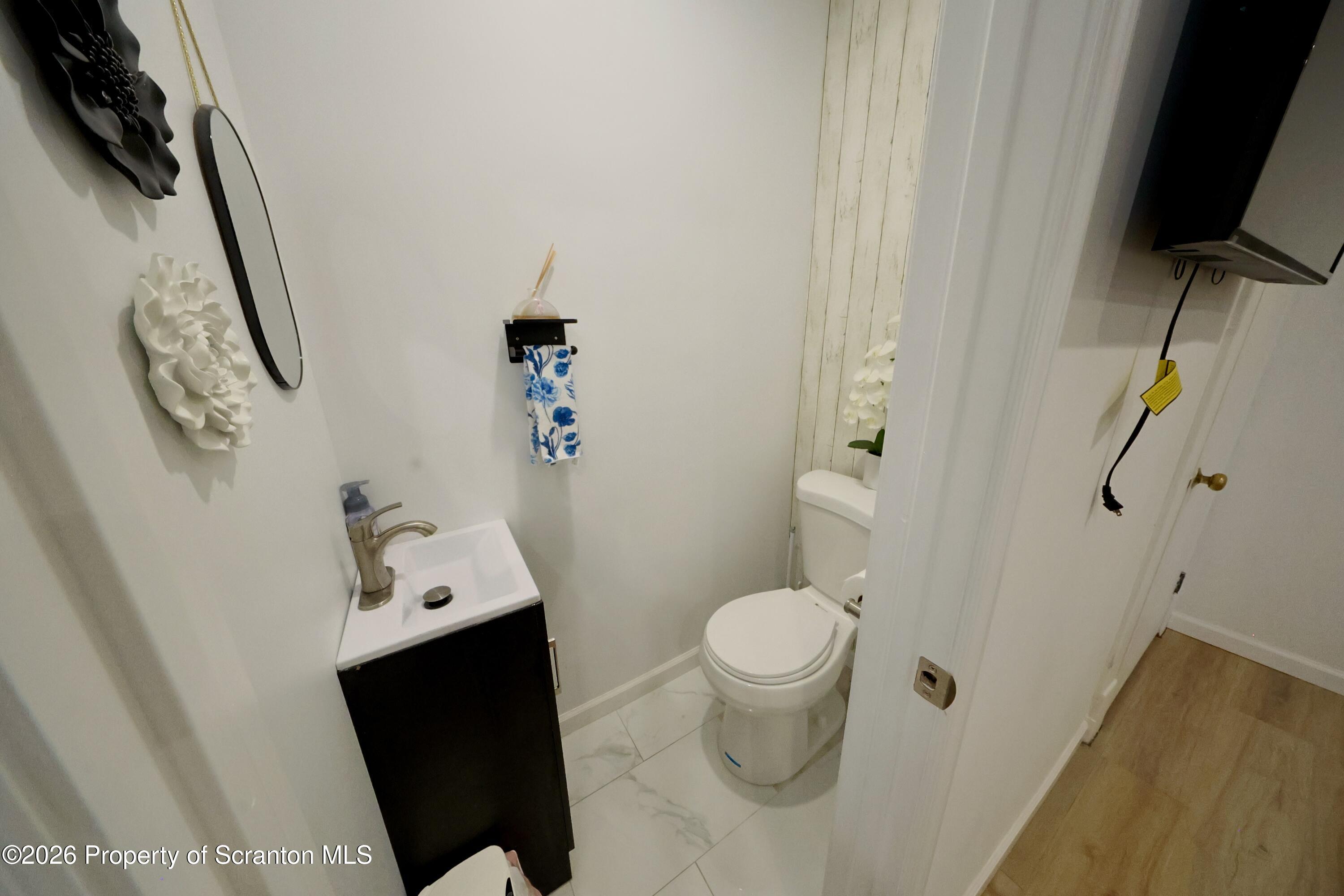 827 Main Street Sugar Notch, PA 18706 - Photo 13 of 25 a bathroom with a sink toilet and shower