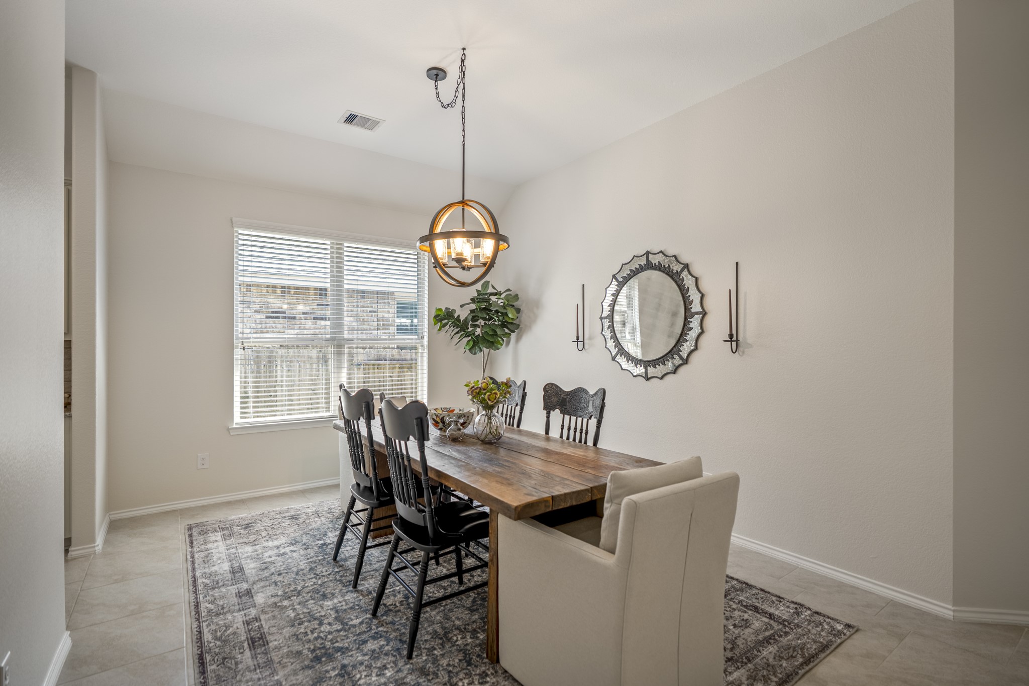 5522 Glenfield Spring Lane Spring, TX 77389 - Photo 13 of 46 Spacious and well-lit with a large window & stylish pendant light.