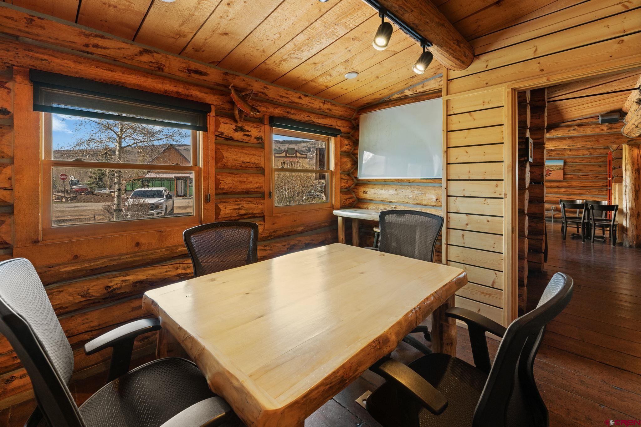 207 Elcho Avenue, Unit 14 Crested Butte, CO 81224 - Photo 18 of 34 a view of a dining room with furniture window and outside view