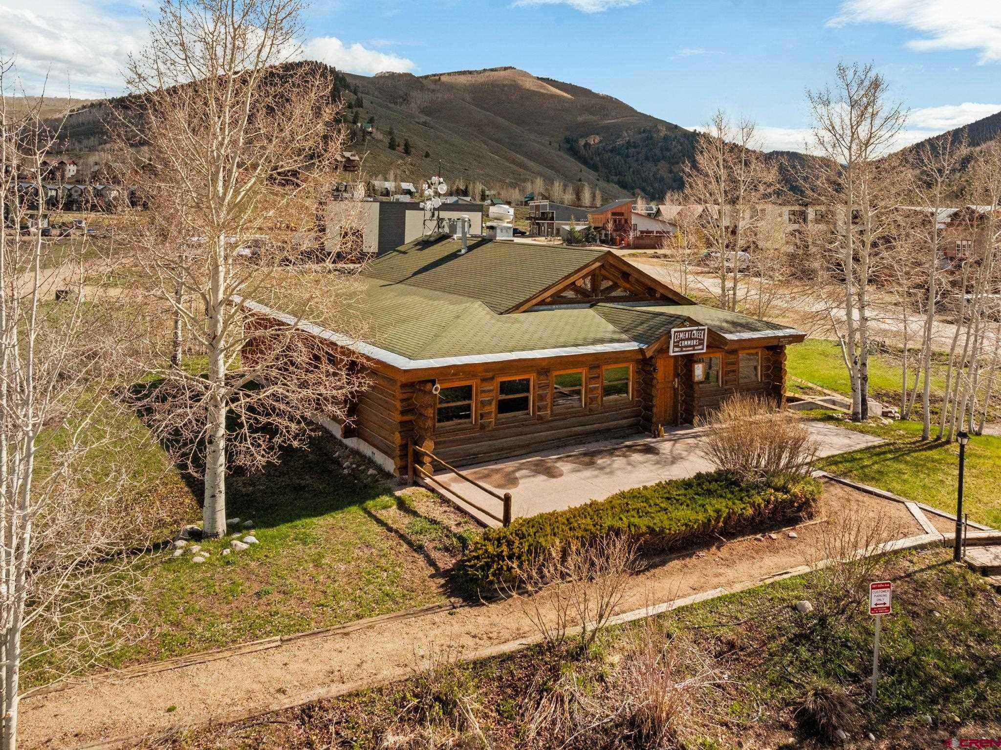 207 Elcho Avenue, Unit 14 Crested Butte, CO 81224 - Photo 2 of 34 a view of a house with a yard
