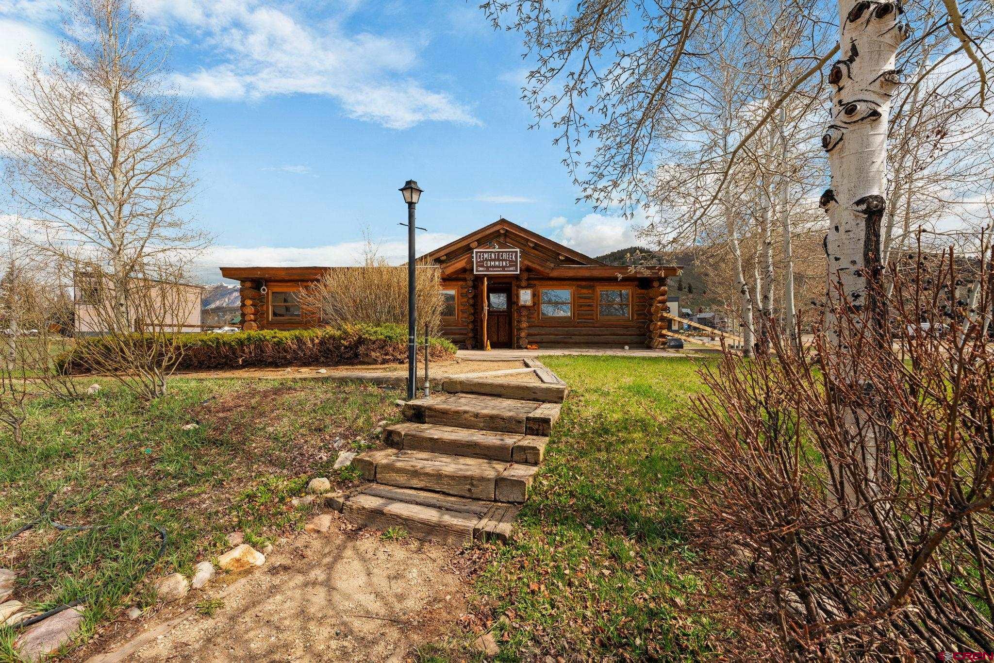 207 Elcho Avenue, Unit 14 Crested Butte, CO 81224 - Photo 27 of 34 a front view of a house with a yard