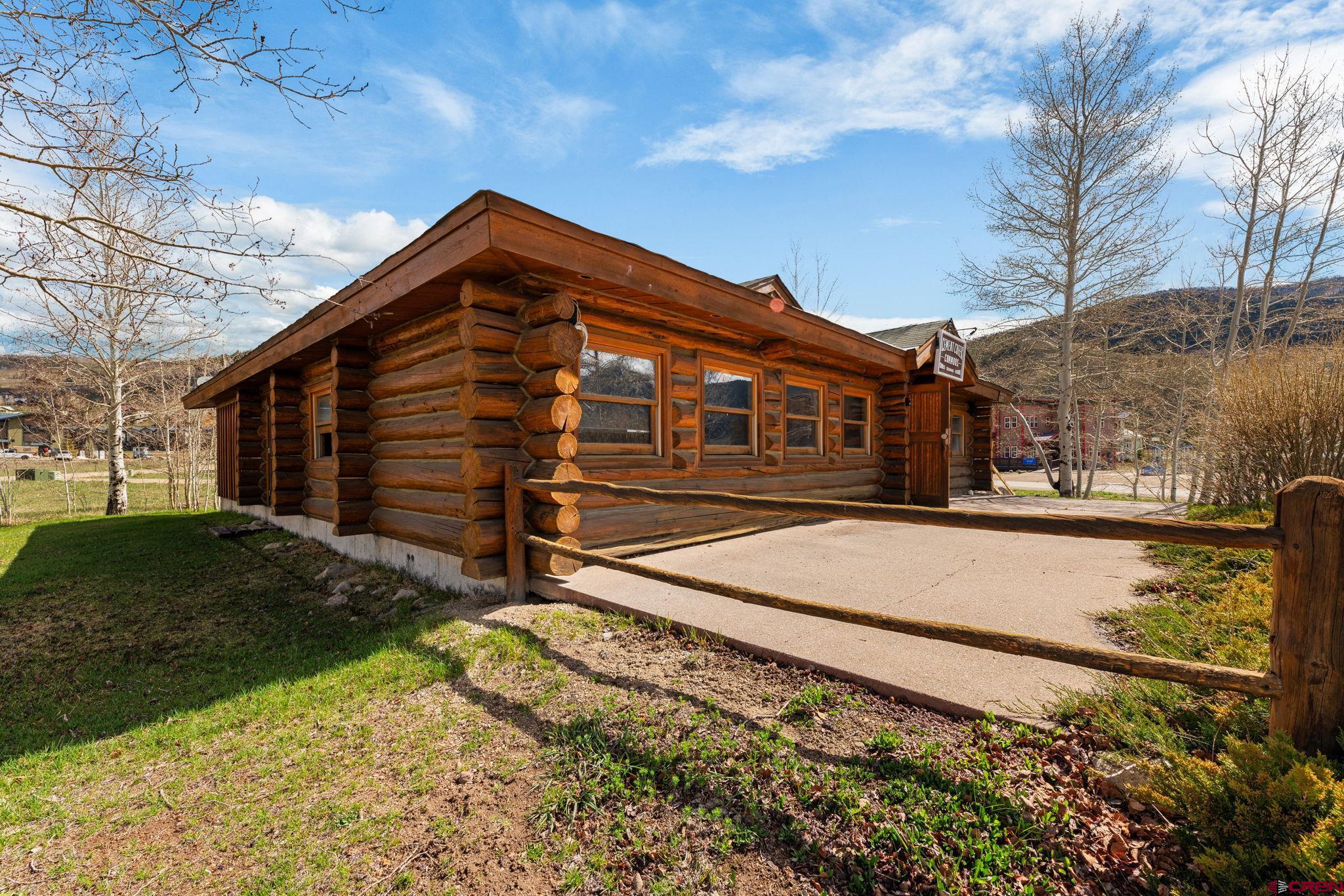 207 Elcho Avenue, Unit 14 Crested Butte, CO 81224 - Photo 28 of 34 a view of a house with a yard