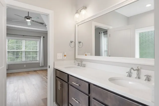 a bathroom with a sink double vanity and a mirror