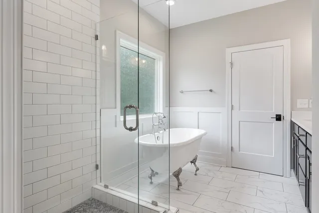 a spacious bathroom with a shower and a sink