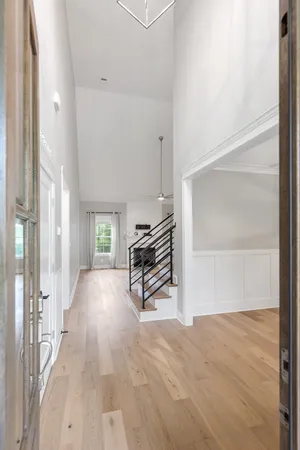 a view of an entryway with wooden floor