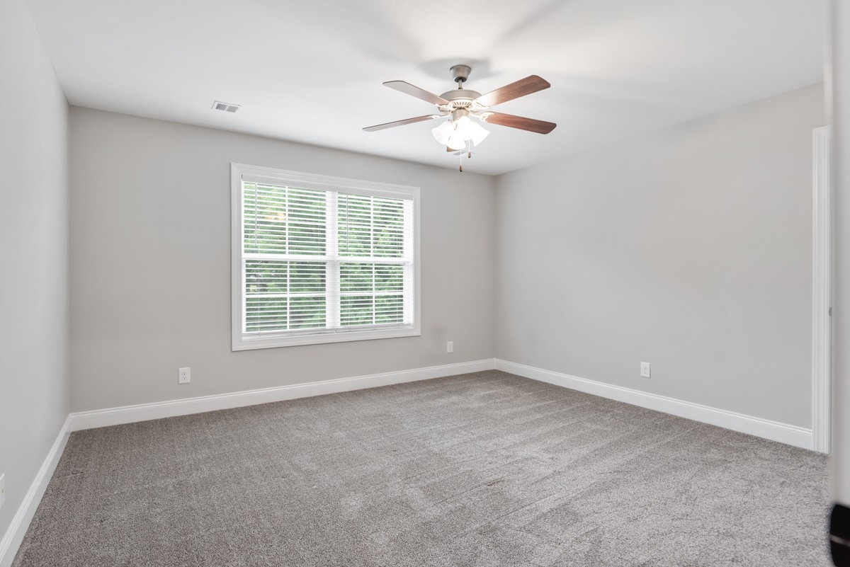488 Sheas Way Clarksville, TN 37043 - Photo 24 of 39 an empty room with windows and fan