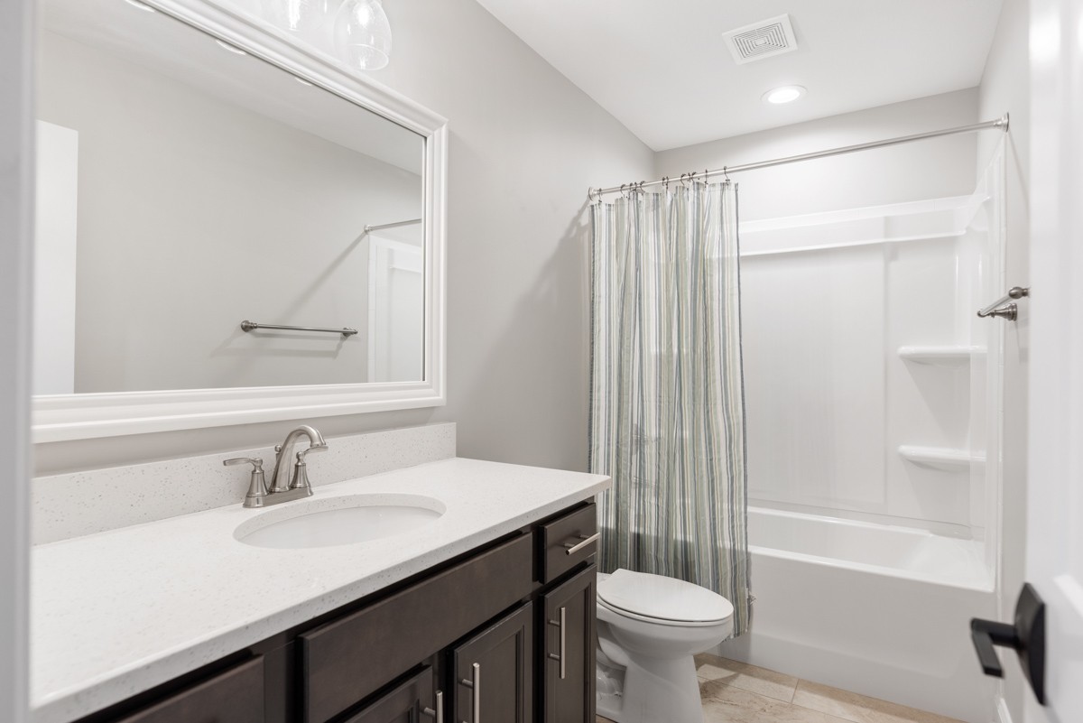 488 Sheas Way Clarksville, TN 37043 - Photo 25 of 39 a bathroom with a sink a toilet and shower
