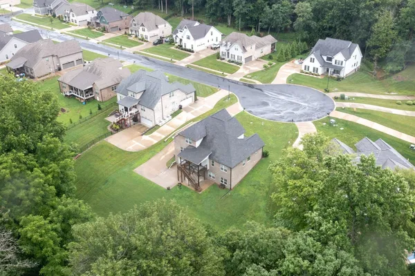 a bird view of house with yard