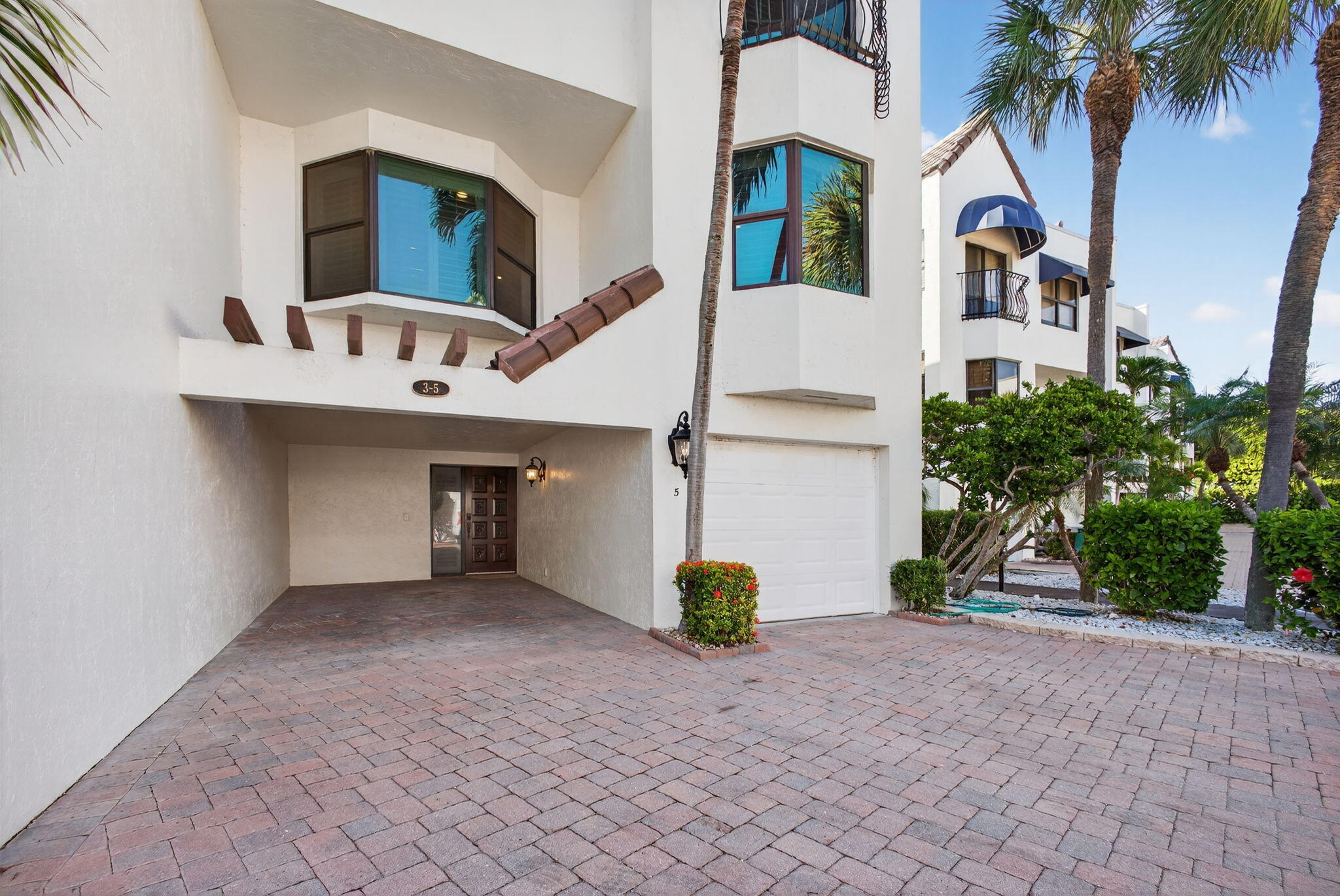 170 Celestial Way, Unit 35 Juno Beach, FL 33408 - Photo 1 of 53 a view of house and outdoor space