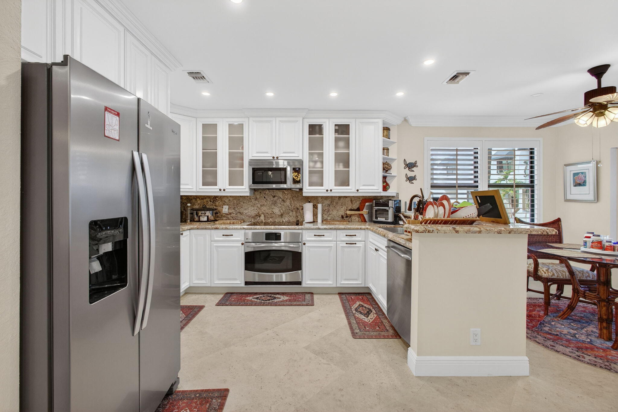 170 Celestial Way, Unit 35 Juno Beach, FL 33408 - Photo 19 of 53 a kitchen with a refrigerator a stove and a sink