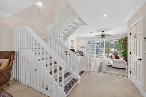 a living room with furniture or couch and a large window