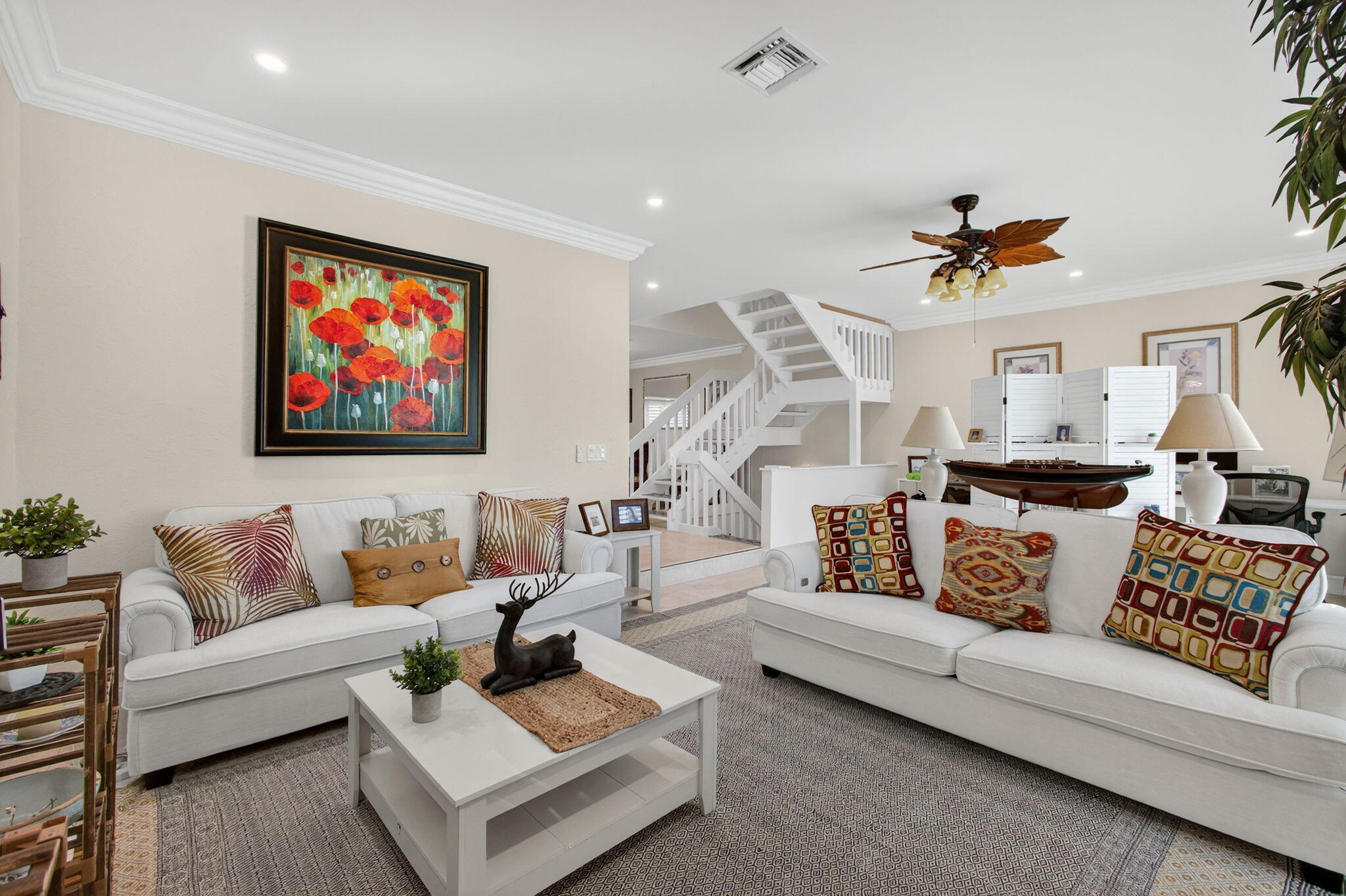 170 Celestial Way, Unit 35 Juno Beach, FL 33408 - Photo 26 of 53 a living room with furniture kitchen view and a chandelier
