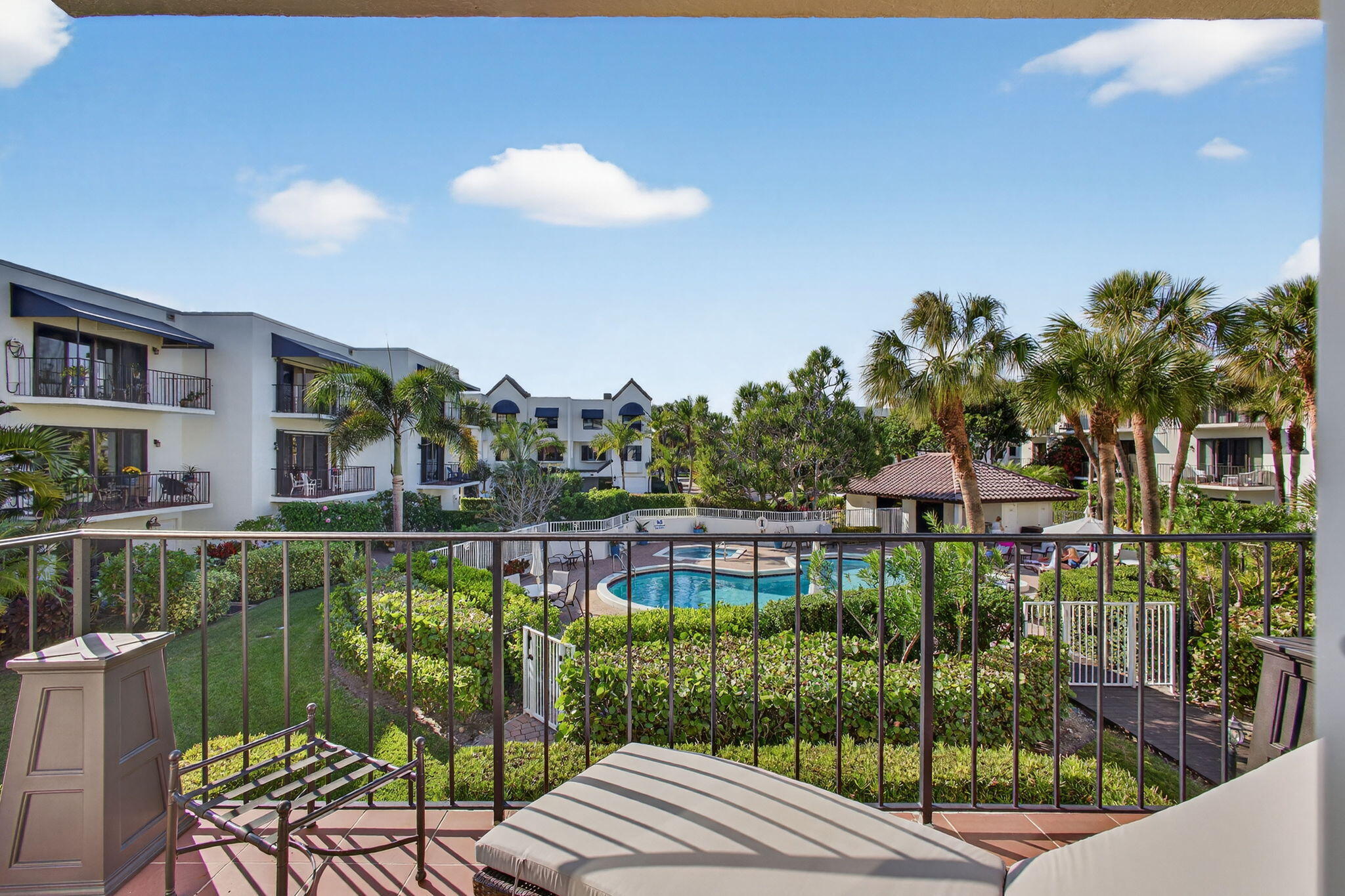 170 Celestial Way, Unit 35 Juno Beach, FL 33408 - Photo 28 of 53 a balcony with outdoor seating and city view