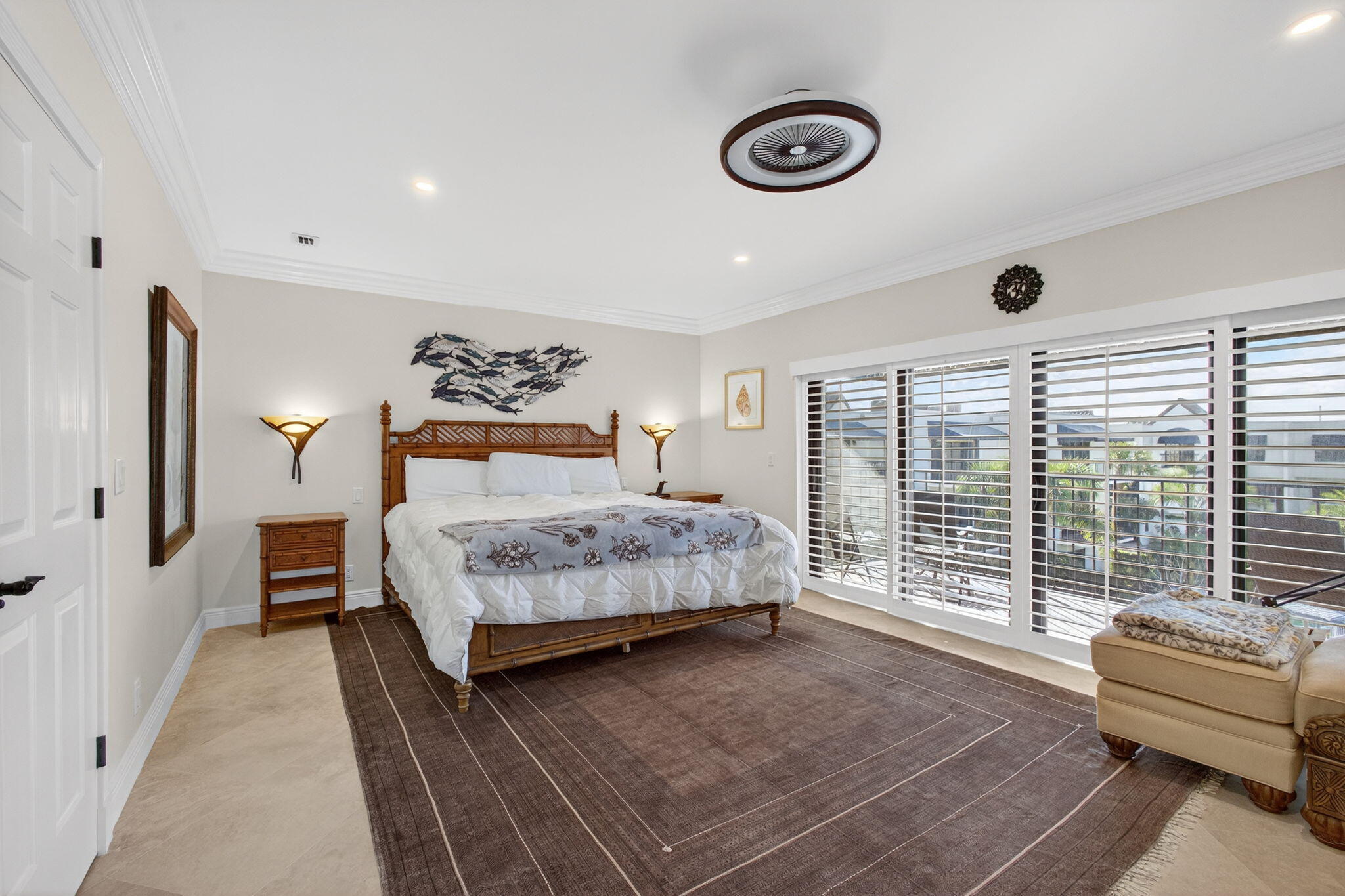 170 Celestial Way, Unit 35 Juno Beach, FL 33408 - Photo 32 of 53 a bedroom with a large bed and a couch