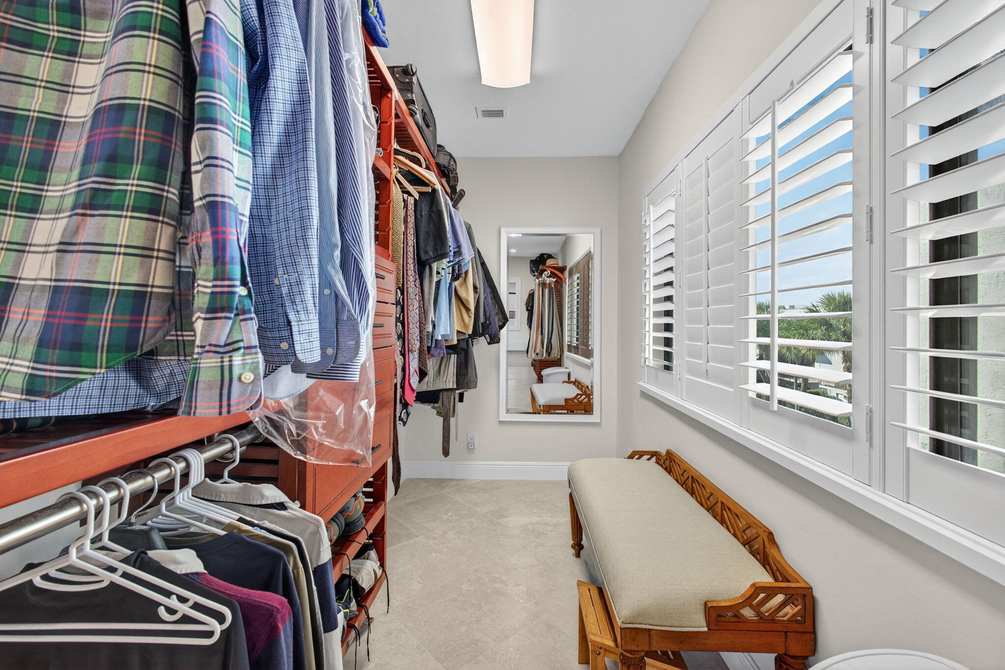 170 Celestial Way, Unit 35 Juno Beach, FL 33408 - Photo 34 of 53 a view of walk in closet with clothes and shoes