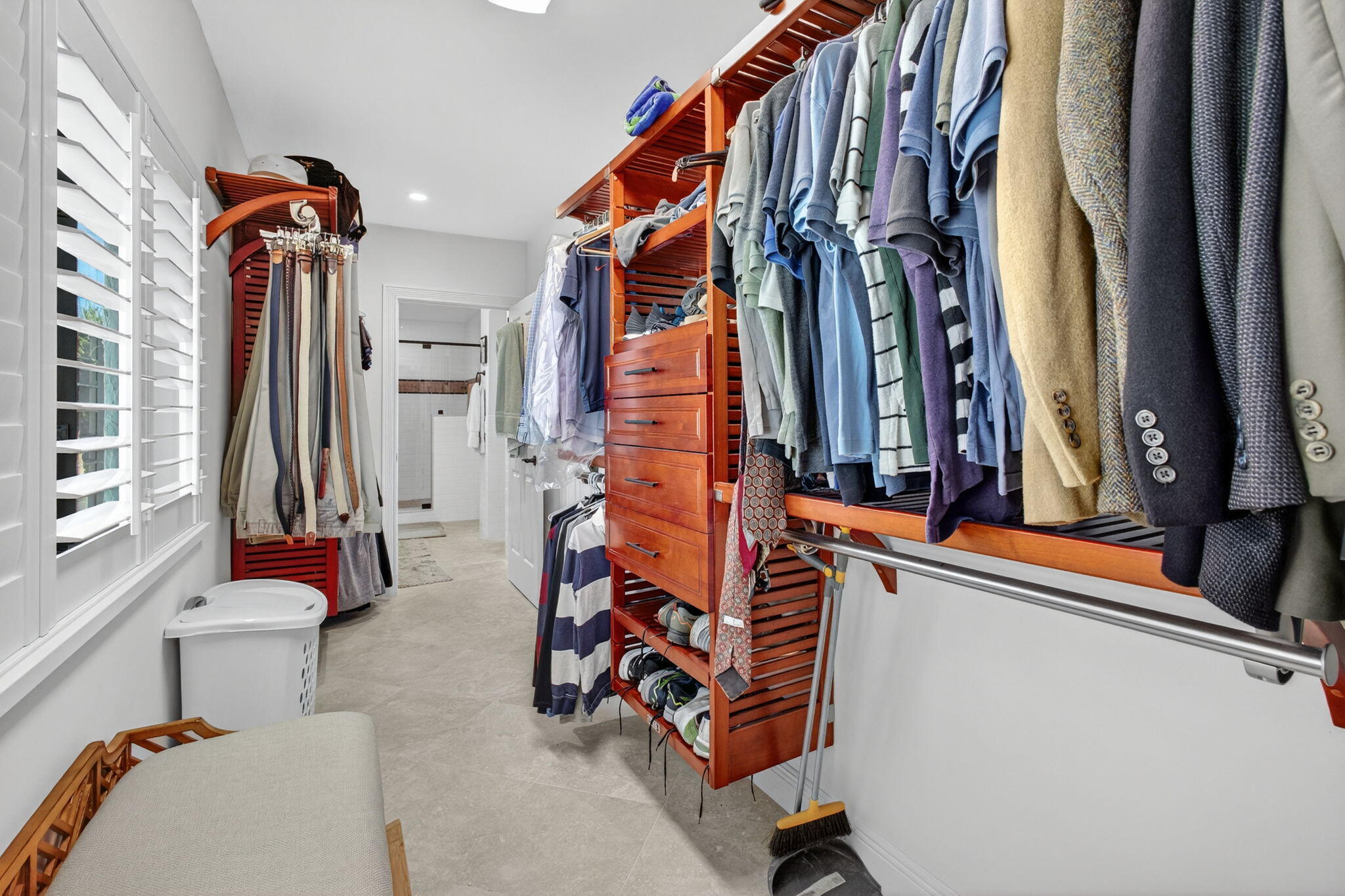 170 Celestial Way, Unit 35 Juno Beach, FL 33408 - Photo 35 of 53 a view of walk in closet with clothes and shoes