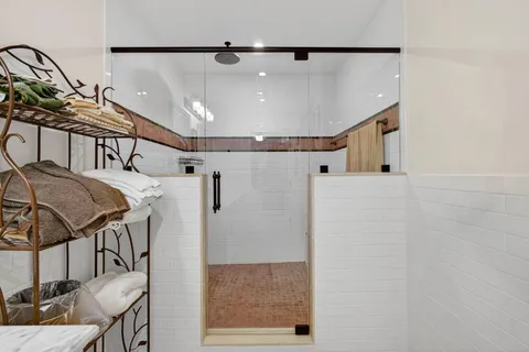 a bedroom with bed and a window