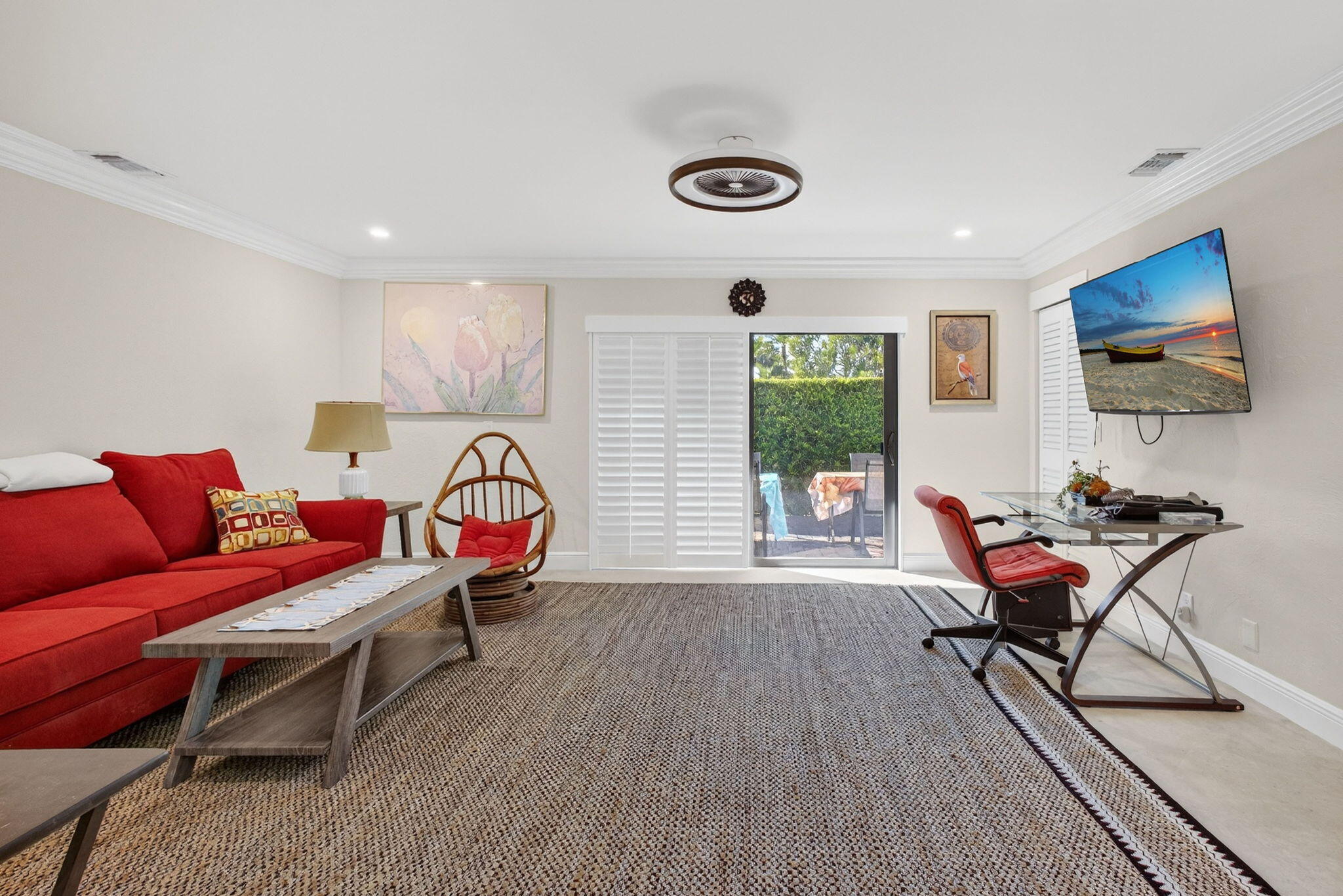 170 Celestial Way, Unit 35 Juno Beach, FL 33408 - Photo 4 of 53 a living room with furniture a rug and a flat screen tv