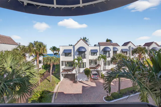 a swimming pool with outdoor seating and yard