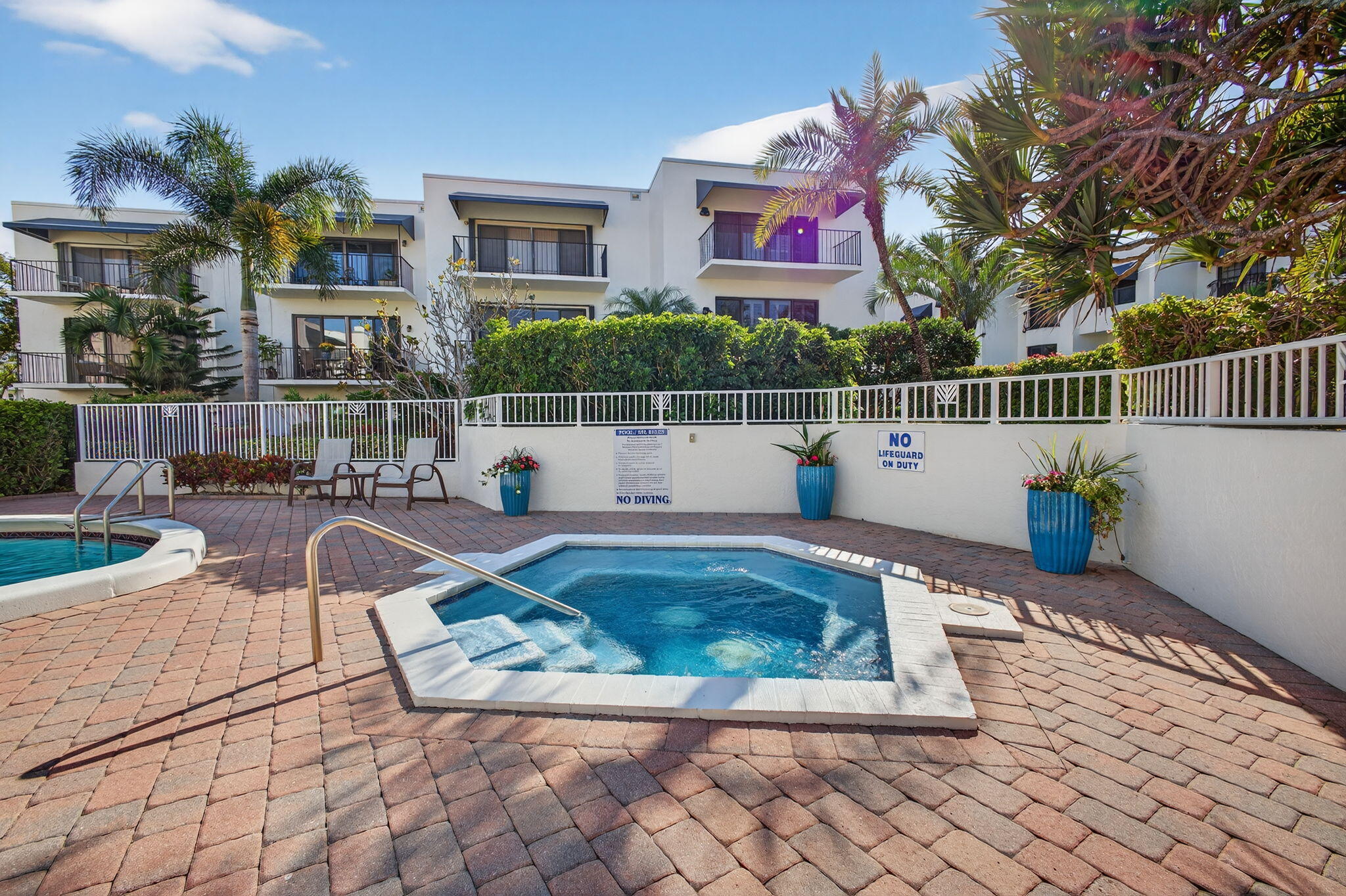 170 Celestial Way, Unit 35 Juno Beach, FL 33408 - Photo 48 of 53 a view of a swimming pool with sitting area
