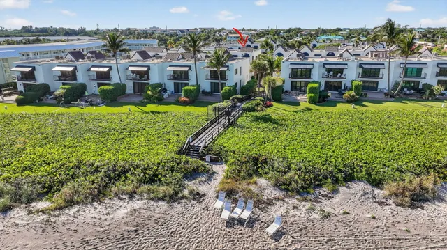 a view of a chairs and table in a patio