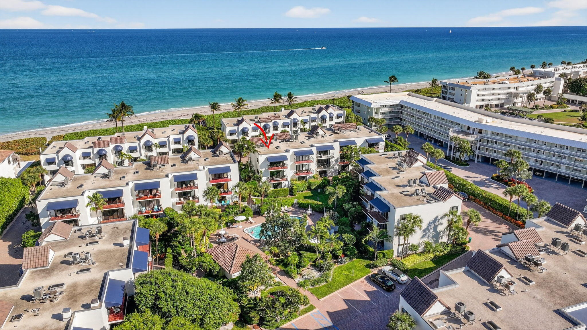 170 Celestial Way, Unit 35 Juno Beach, FL 33408 - Photo 51 of 53 a view of building with outdoor space and seating area