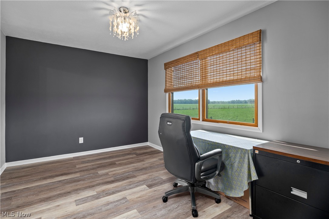 14120 Mason Road Vermilion, OH 44089 - Photo 16 of 50 Home office featuring a chandelier and light hardwood / wood-style floors